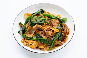 Stir fried flat noodle and pork with soy sauce.