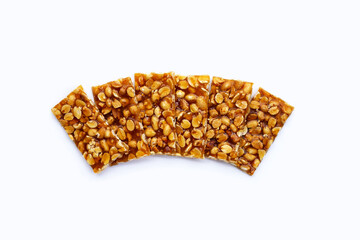 Honey bars with peanuts on white background