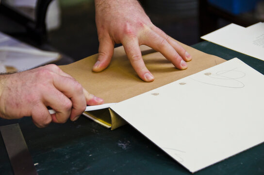 Close up of hands of book binder