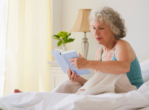 Woman reading in bed