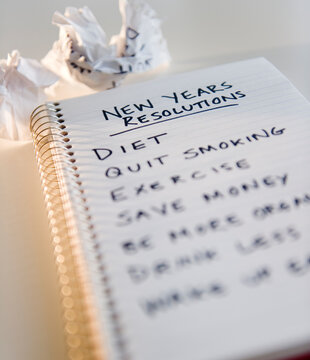 Close up of notebook with list of resolutions for new year