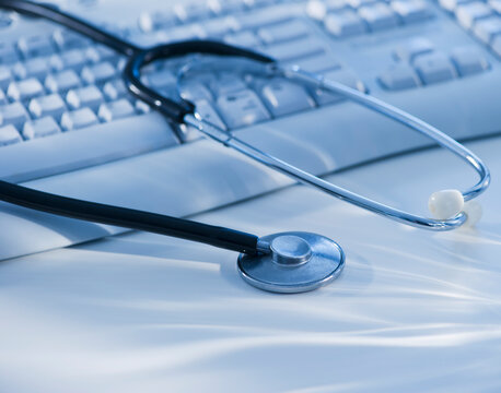 Close-up view of blue globe with stethoscope