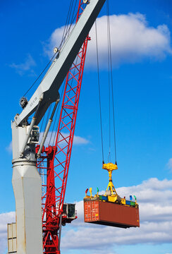 Crane lifting shipping container