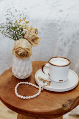 Coffee cup cappuccino, vintage dried flowers, cozy home. Hygge, Lagom, Moody. Cosy autumn winter concept