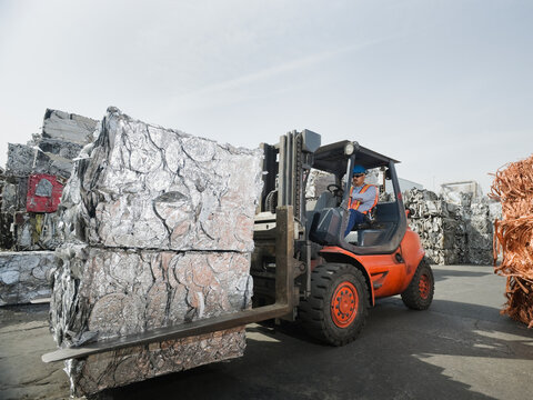 Forklift driver at recycling plant