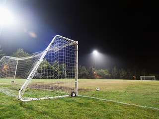 USA, California, Ladera Ranch, illuminated soccer field at night