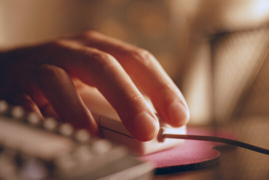 Hand on a computer mouse