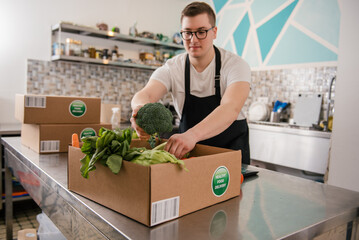 Man packing fresh fruits and vegetables