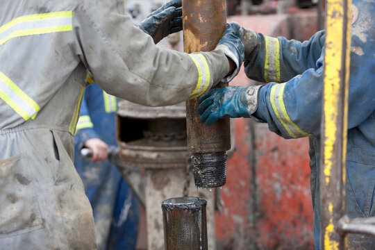 Oil workers drilling for oil on rig