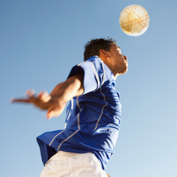 Soccer player heading the ball