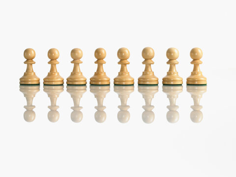 Row of pawn chess pieces