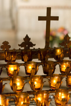 Cross with candles in cathedral