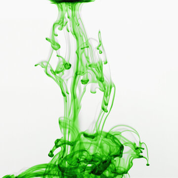 Studio shot of green dye in abstract shape