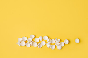 easter egg on the yellow background with the place for the text for greeting