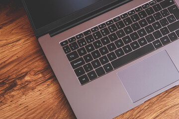 2021 model laptop on a desk at home, ready to do work at home