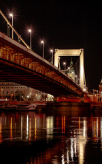 Fototapeta na wymiar Budapest at night, Erzsebet bridge on the Danube river, reflection of night lights on the water