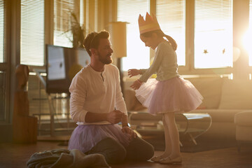 Dad and daughter dressing up toghether