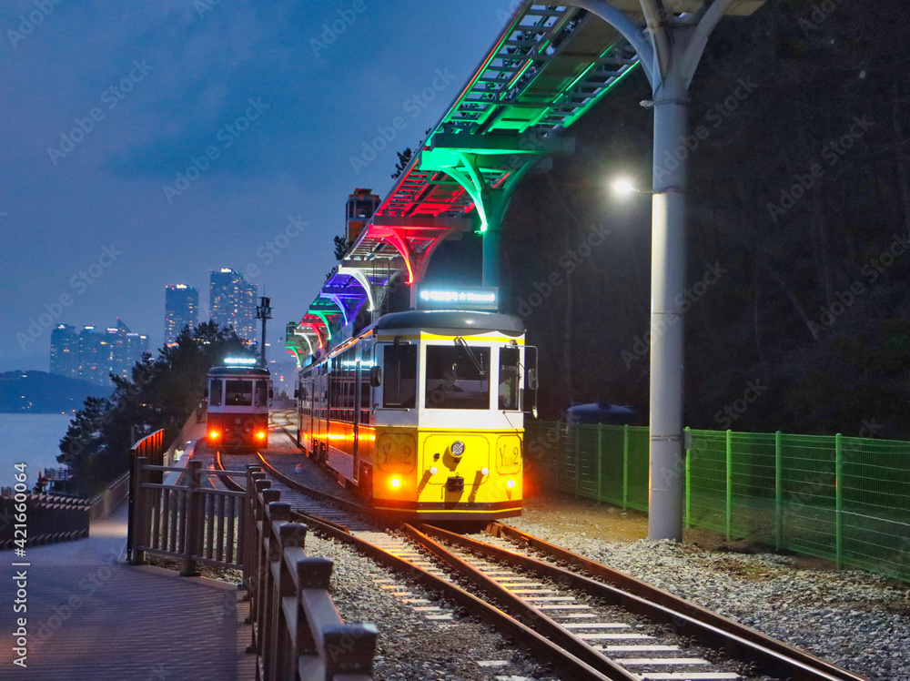 Wall mural night view of haeundae beach train, busan, south korea, asia.