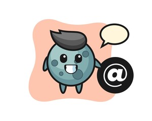 Cartoon illustration of asteroid standing beside the At symbol