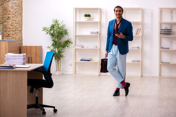 Young male employee in oversleeping concept