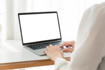 computer screen blank mockup.hand woman work using laptop with white background for advertising,contact business search information on desk at coffee shop.marketing and creative design