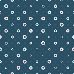 Geometric Polka Dot seamless vector pattern with blue and pink circles and semicircles on dark blue background. Playful stylish texture for wallpaper, wrapping paper and fashion fabrics.