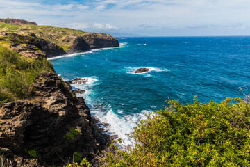 Fototapeta premium Waves Crashing Against The Rocky Shoreline of Papanalohoa Point, Maui, Hawaii, UISA