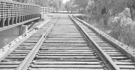 Black and white photo of old rail road tracks.