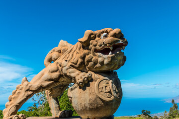 Fototapeta na wymiar Traditional Chinese Foo Dog Dragon Sculptures Gaurding The Gateway Into Sun Yat Sen Memorial Park, Kula, Maui, Hawaii, USA