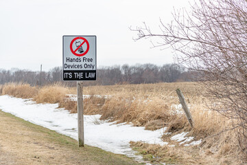 Hands free devices only it's the law road sign
