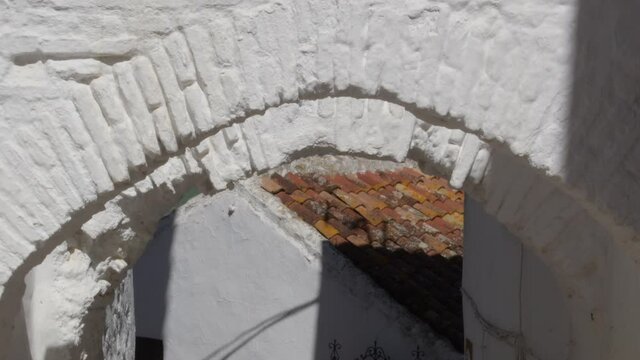 Ancient horseshoes arcs in a moorish street in Comares, Axarquia, Spain