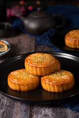 Chinese Mid-Autumn Festival moon cake on wooden background