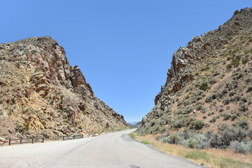 At the edge of the dry Little Salt Lake, lies a natural gap in the mountains, covered with hundreds...