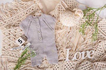 Mockup for announcement pregnancy . Space for text on textile background