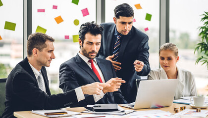 Group of professional business meeting and discussing strategy with new startup project.Creative business people planning and brainstorm with laptop computer in modern office.Teamwork concept