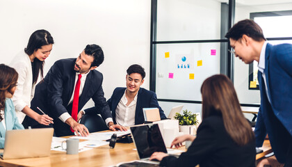Group of professional business presentation meeting and discussing strategy with new startup project.Creative business people planning and brainstorm with laptop computer in modern office.Teamwork