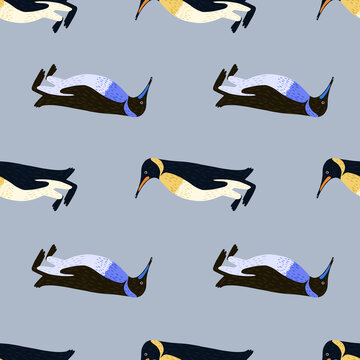 Childish cartoon seamless pattern with hand drawn penguins ornament print. Blue background.