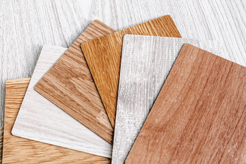 Obraz na płótnie Canvas Choice of laminate color. Wood-colored fan for flooring.