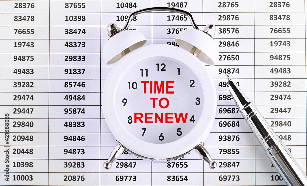 Poster business concept. text time to renew on the alarm clock on chart background
