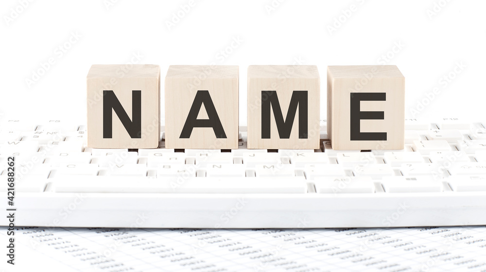 Poster name -word wooden block on keyboard background witn chart