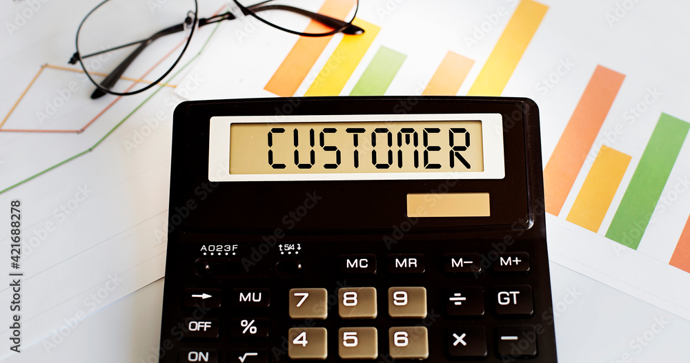 Poster calculator with the word customer on the display with chart and glasses