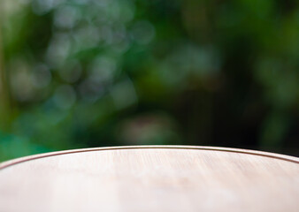 Abstract nature deforcus light effect background with wooden plank on foreground. Ideal for background,wallpaper ,tuxture etc.,