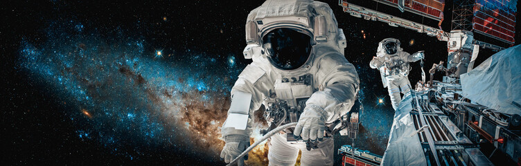 Astronaut spaceman do spacewalk while working for space station in outer space . Astronaut wear...