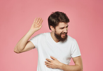 Portrait of a cheerful man on a pink background emotions cropped view