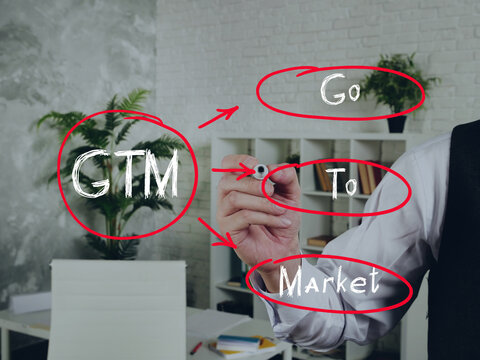  GTM Go To Market note. Fashion and modern office interiors on an background.