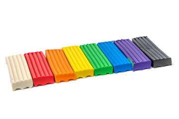Composition of colored plasticine on isolated white background. colorful molding dough. polymer clay
