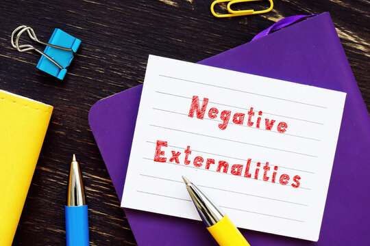 Business concept meaning Negative Externalities with sign on the page.