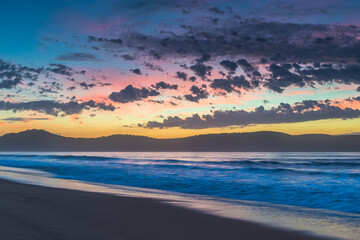 Fototapeta premium Sunrise seascape at the beach with haze and cloud