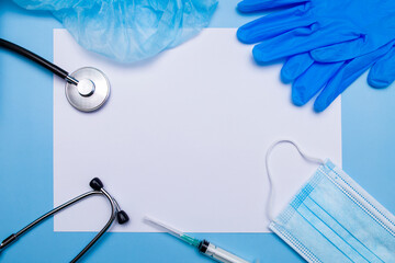 Medical clipboard, stethoscope, rubber gloves, protective mask on a blue background. Medical banner template with copy space, header layout. Health care and medical concept.