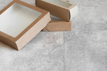 A pile of cardboard food boxes on the table close up background.